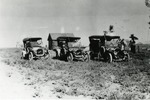 Three Automobiles Lined Up