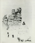 Men Climbing Castle Rock
