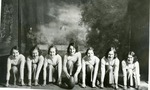 Seven Women Pose with a Football
