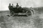 Two Men and a Woman in an Automobile