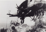 Soldiers Exiting a Hovering Huey