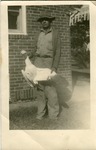 2012-1-354: Man Holding a Goose
