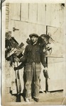 2012-1-367: Man Standing with Pelts