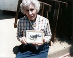 Woman Holding a Framed Photograph