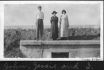 People Standing on a Concrete Culvert