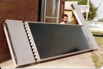 Karl Brubaker Holding Up a Solar Collector