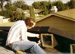 Man Working on a Roof
