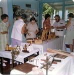 People Viewing Wood Carvings