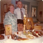 Mr. and Mrs. E. J. Steiner By a Display of Woodcarvings