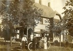 James D. Nicholson Family by an Automobile