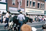 Two Men and Two Yoked Cows in a Parade