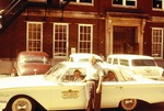 J. Birch Stuart Standing Next to the Driver's Education Automobile