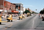 Shriners Riding in Mini-Airplanes in a Parade
