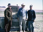 Art Frey and Mr. Wiebe with Another Man by the Chisholm Trail Marker
