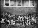 Group Portrait in Front of a Brick Building