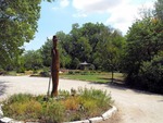 A 1999 sculpture called "The Plainsman" by John Gaeddert stands in the circle drive by the Memorial Grove park area on the Bethel College Campus