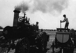 Clinton Spencer and a Boy Working a Steam Engine Demonstration by Linda Koppes