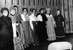 Eight Women Wear Prairie Dress Costumes