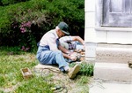Two Men Removing a Cornerstone