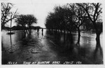 Two Men Stand in Flood Waters in Burrton by Homer T. Harden