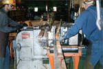 Two Men Working with Machinery