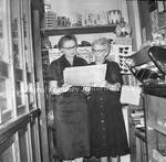 Two Women in the Newsstand