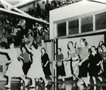 Cheerleaders and Players Running Onto Court by Fort Hays State University Athletics