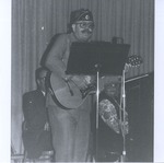 Bob Maxwell Playing Guitar and Singing to ROTC Members