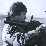 ROTC Member Shoulders Large Firearm