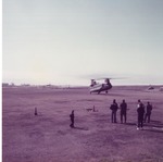 ROTC Members on Airfield Watching a Chinook Helicopter