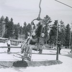 ROTC Members Waving at Camera on Ski Lift