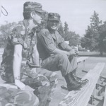 ROTC Member and Instructor Sit Together Talking