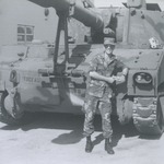 ROTC Member in Front of Transport Vehicle