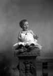 Box 1, Neg. No. Unknown: Baby Sitting on a Pedestal