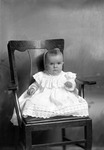 Box 12, Neg. No. 6379: Baby Sitting in a Chair by William R. Gray