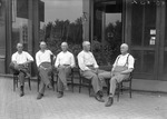 Box 12, Neg. No. 6563X: Five Bald Men Sitting Outside
