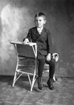 Box 14, Neg. No. 9401B: Boy in a Suit Sitting