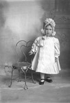Box 15, Neg. No. 9712: Girl Standing at a Chair