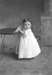 Box 15, Neg. No. 9887: Baby Standing at a Table