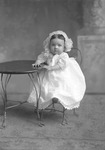 Box 15, Neg. No. 9887:  Baby Sitting at a Table