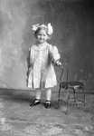 Box 16, Neg. No. 11017: Girl Standing by a Chair