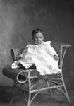 Box 16, Neg. No. 11055: Baby Sitting on a Chair