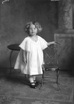 Box 16, Neg. No. 11037: Girl Standing by a Chair