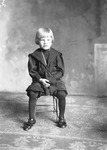 Box 16, Neg. No. 11037: Boy Sitting on a Chair