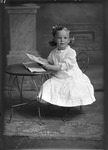 Box 19, Neg. No. 24002: Girl Sitting with a Book