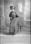 Box 19, Neg. No. 25027: Woman Leaning on a Chair