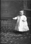 Box 20, Neg. No. 28082: Baby Standing and Holding onto a Table