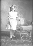 Box 21, Neg. No. 30339: Girl Standing Next to a Chair
