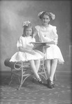 Box 22, Neg. No. 30386: Two Girls Sitting with a Book