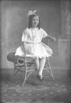 Box 22, Neg. No. 30386: Girl Sitting with Feet Crossed